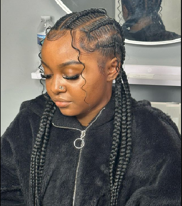 A girl showing her braids from front