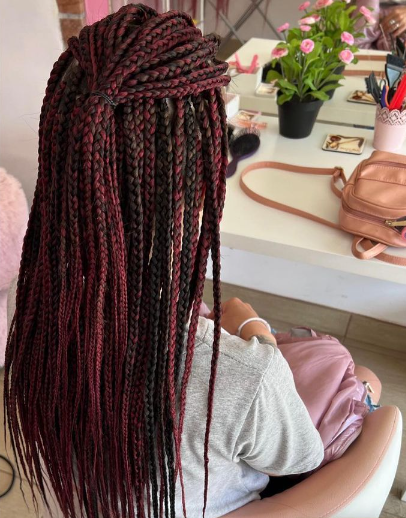 Black and burgundy braids shown from back