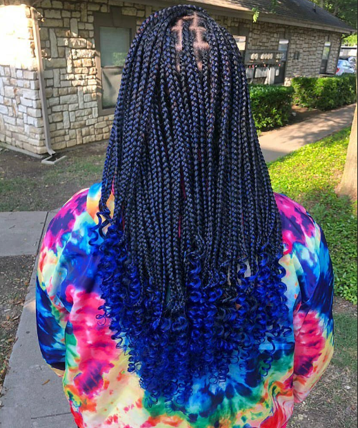 Blue feed in braids, shown from back