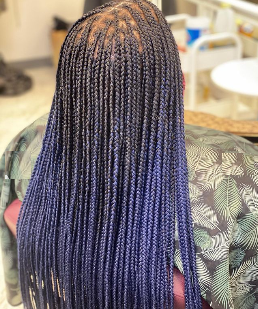 Blue cornrows braids shown from back, girl sitting on a chair