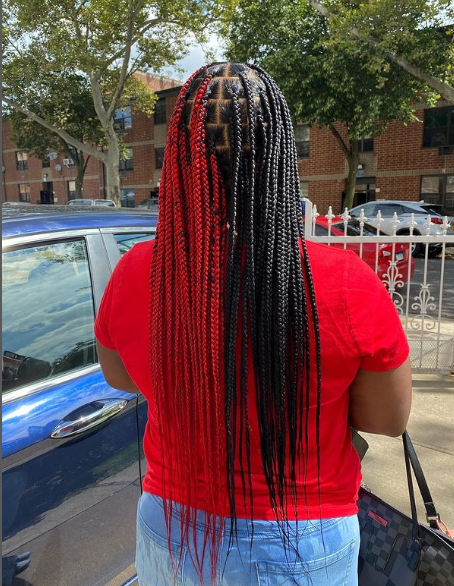 Female with Red And Black Knotless Braids