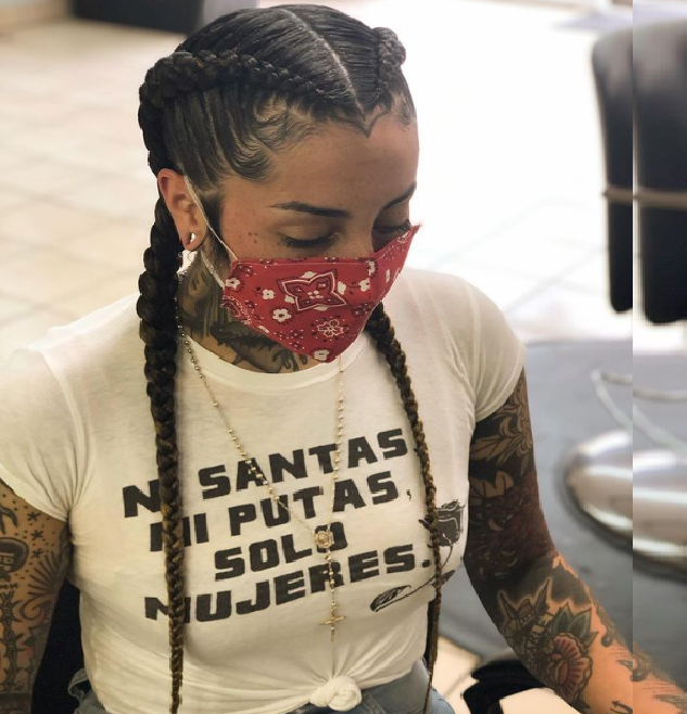A girl showing her braids, wearing a mask
