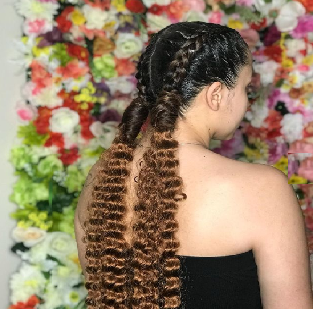 Back side of the girl with braids