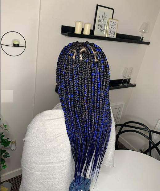 Blue and black knotless braids, girl's back side
