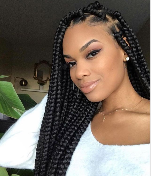 Female with Big Knotless Braids