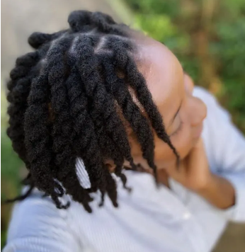 Female with Loose Braids On Natural Hair